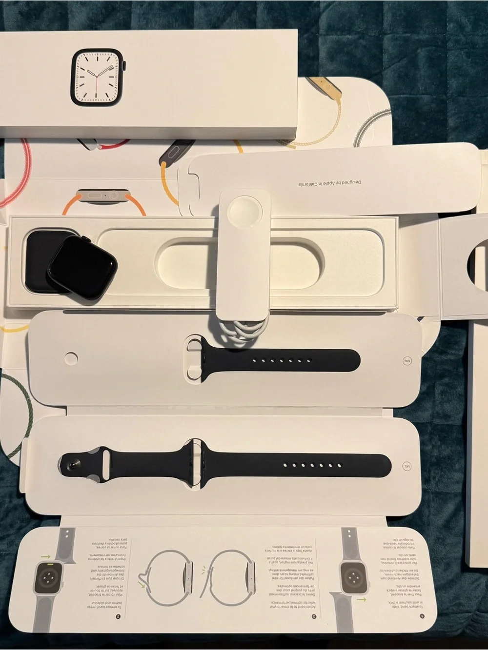 Apple Watch with Black Sport Band and Charger